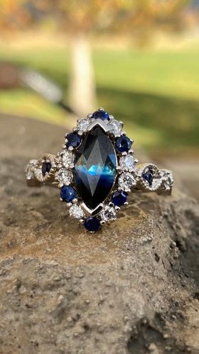 Custom Bridal.  Gemstone with known source.  Side sapphires cut from same rough. 