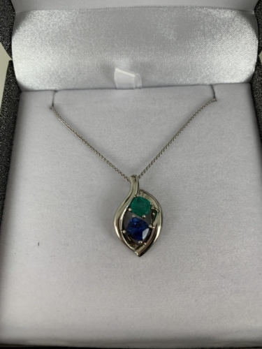 Mother's pendant with custom mounting.  Gemstones with know source.  